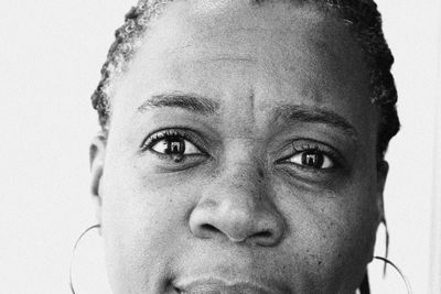 Close-up portrait of man against wall