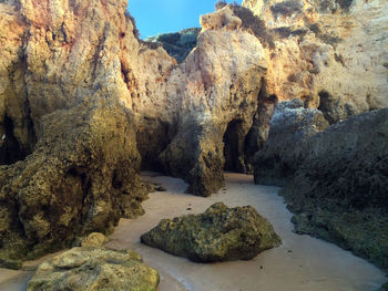 Rocks on shore by sea