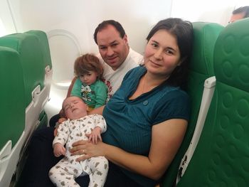 Family traveling in airplane