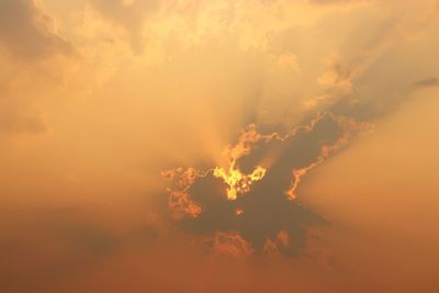 Low angle view of dramatic sky during sunset