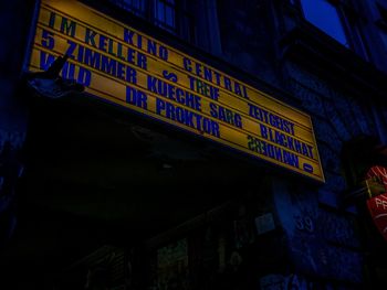Low angle view of information sign in city