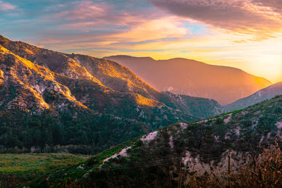 Scenic view of mountains against sky during sunset