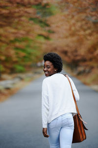 Portrait of smiling woman walking outdoors