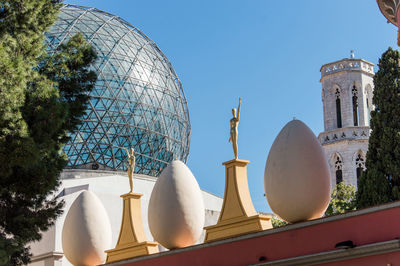 Low angle view of traditional building against clear blue sky