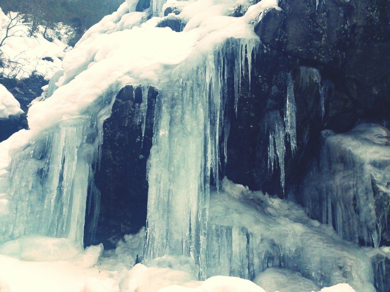 snow, winter, cold temperature, season, rock - object, beauty in nature, frozen, waterfall, nature, scenics, rock formation, motion, weather, white color, tranquility, flowing water, ice, non-urban scene, tranquil scene, long exposure