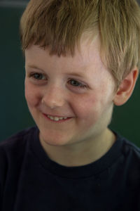 Close-up portrait of smiling boy