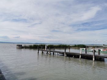 Pier on sea against sky