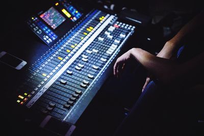 High angle view of man by sound mixer