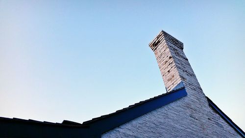 Low angle view of building against clear blue sky