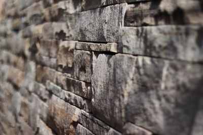 Close-up of stone wall in and out of focus