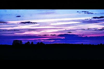 Scenic view of river at sunset