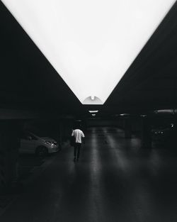 Man walking in illuminated bus