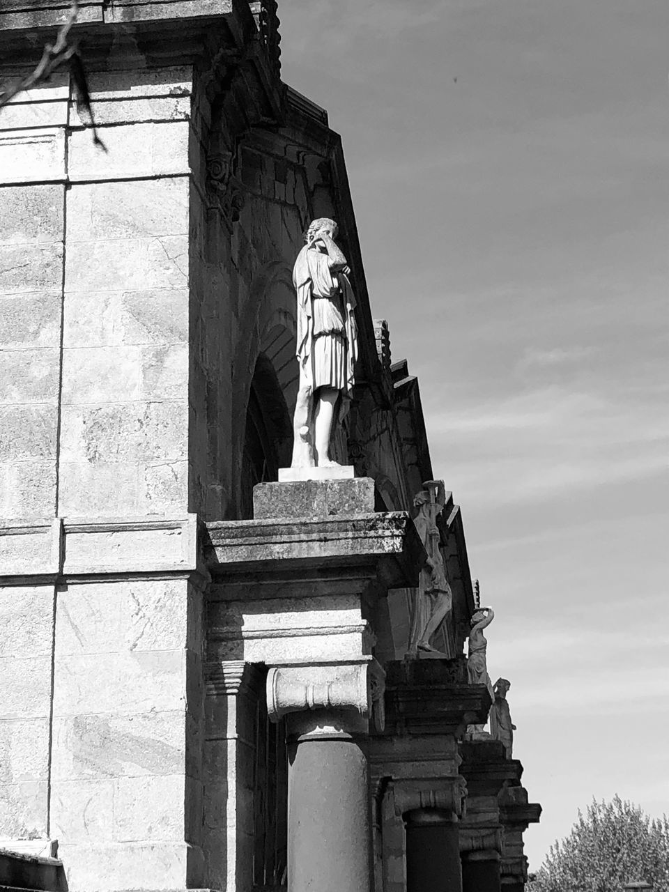 sculpture, statue, architecture, human representation, representation, built structure, art and craft, low angle view, male likeness, sky, history, day, the past, creativity, building exterior, craft, no people, architectural column, nature, religion, outdoors