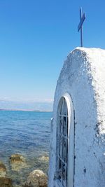 Scenic view of sea against clear blue sky