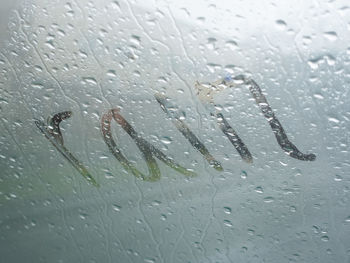 Close-up of raindrops on glass window