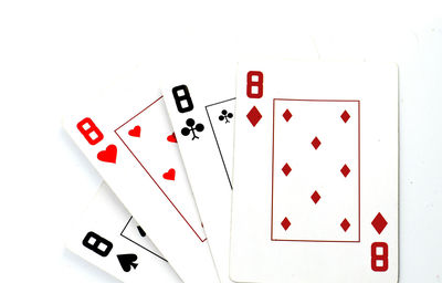 Close-up of playing cards on white background