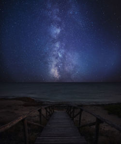 Scenic view of sea against sky at night