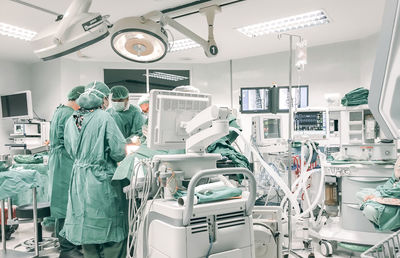 Doctors working in operating room at hospital