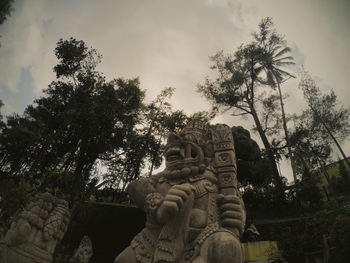 Low angle view of statue against sky