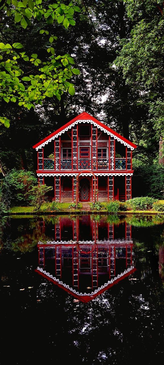 RED BUILT STRUCTURE IN GARDEN