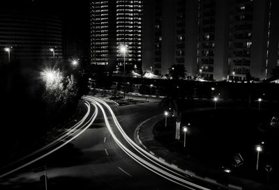 High angle view of light trails on road at night