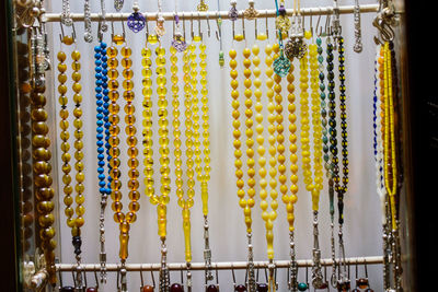 Close-up of multi colored decorations hanging in market