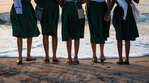 Low section of women standing on ground