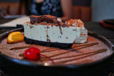 Close-up of cake slice in plate on table