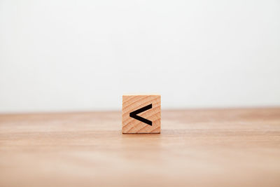 Close-up of toy blocks on table against white background