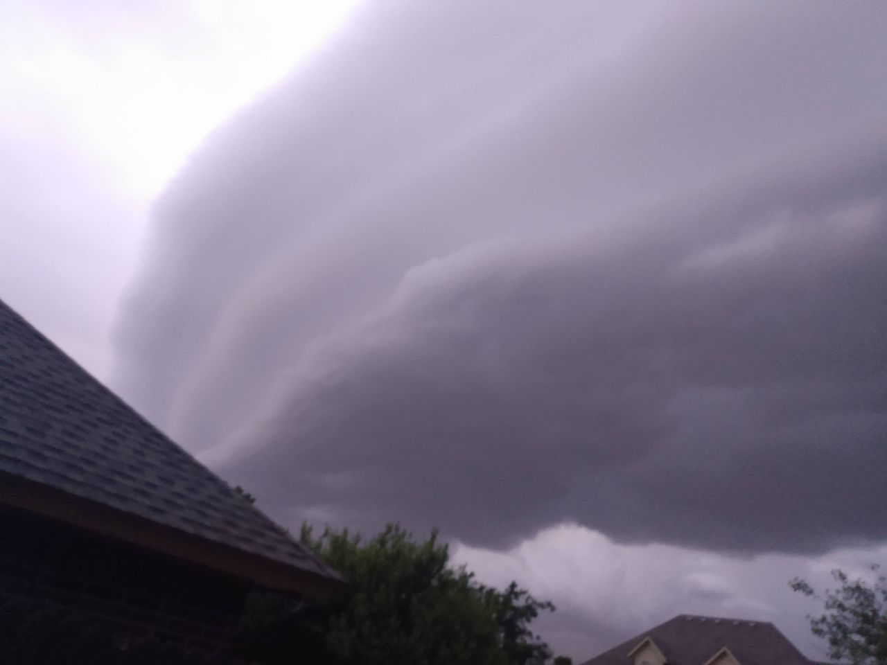 cloud, sky, architecture, building exterior, storm, built structure, thunderstorm, house, building, nature, beauty in nature, no people, roof, environment, storm cloud, tree, thunder, low angle view, outdoors, dramatic sky, overcast, residential district, power in nature, plant