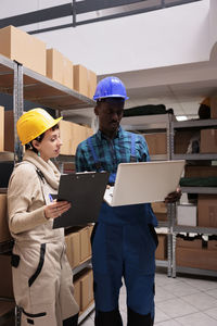 Rear view of man working at office