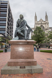 Statue of buddha against sky