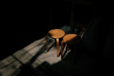 High angle view of empty chair on table