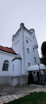 Low angle view of old building against clear sky