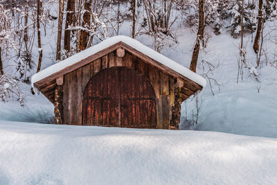 Built structure on snow covered field