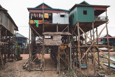 Stilt houses against sky