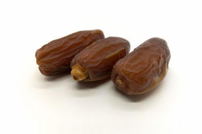 Close-up of bananas against white background