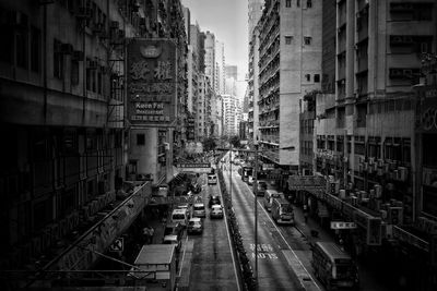 High angle view of vehicles on road amidst building