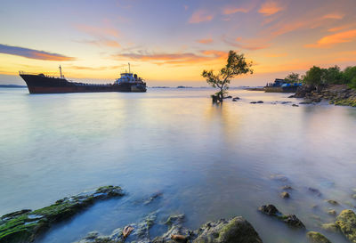 Scenic view of sea against sky during sunset