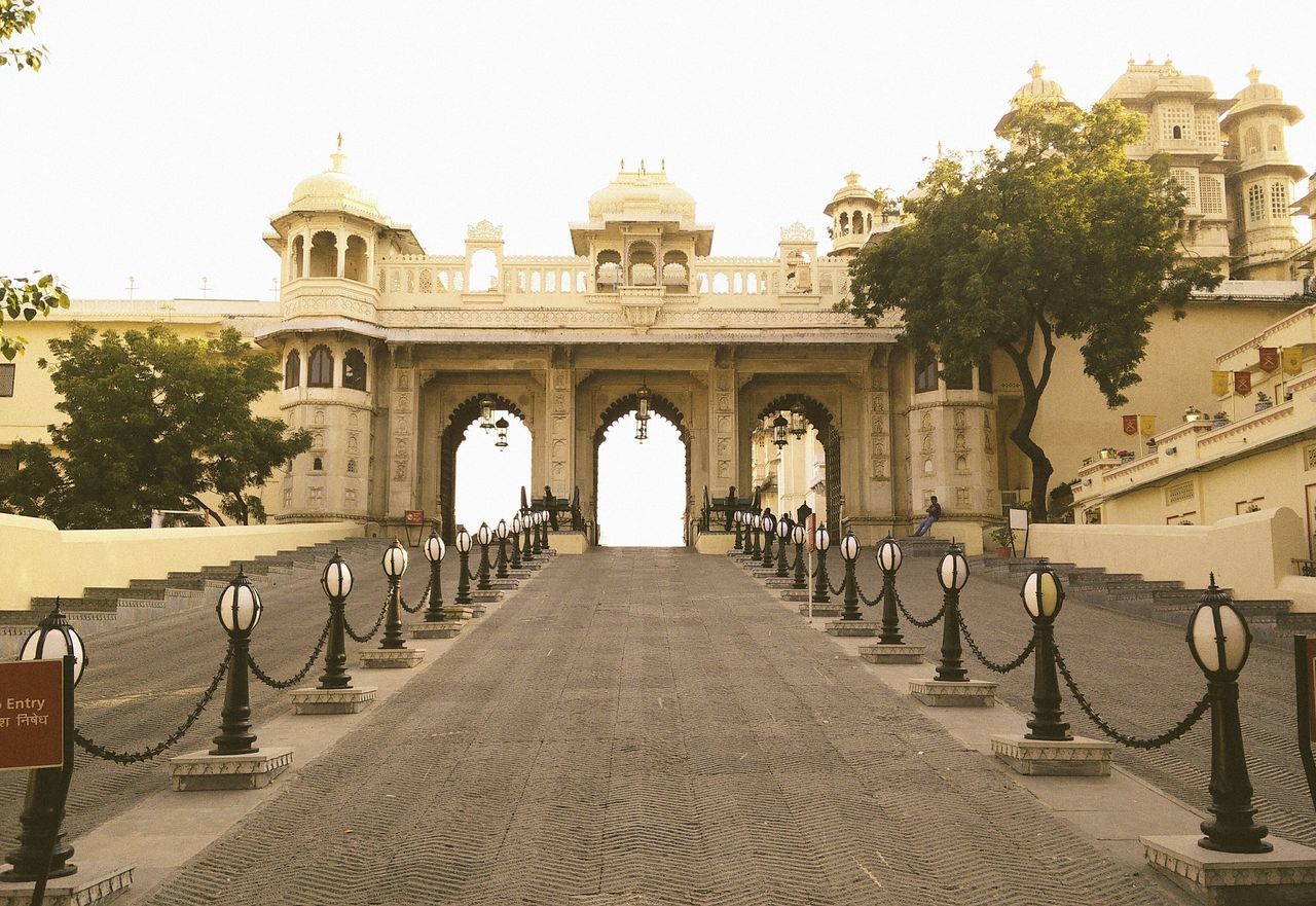 architecture, built structure, building exterior, history, famous place, arch, clear sky, travel destinations, place of worship, tourism, religion, travel, spirituality, incidental people, day, tree, international landmark, ancient, outdoors, sky