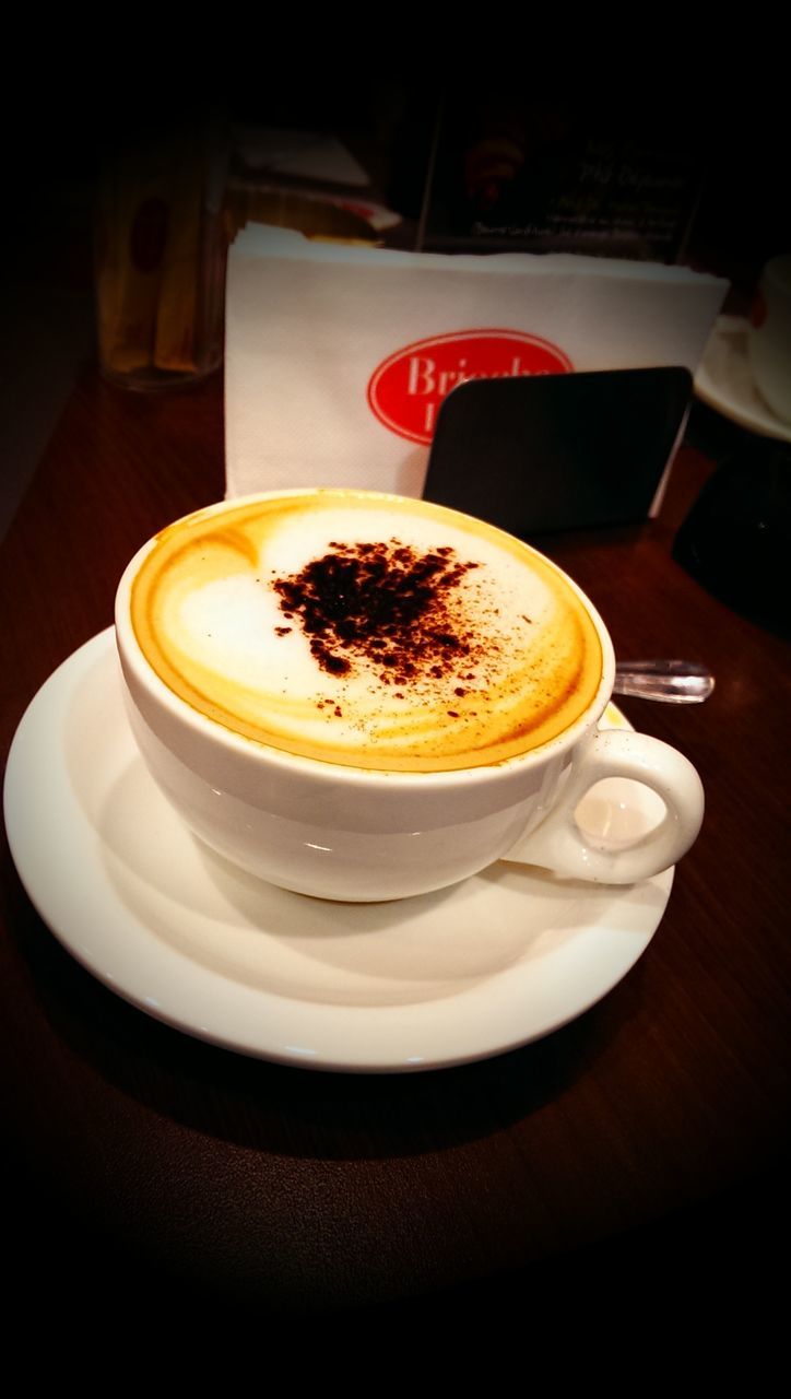 food and drink, indoors, coffee cup, drink, table, freshness, coffee - drink, saucer, refreshment, coffee, still life, cup, frothy drink, plate, close-up, spoon, cappuccino, food, high angle view, breakfast