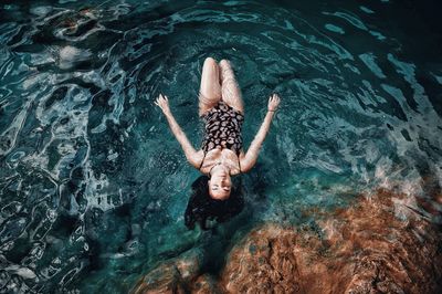 High angle view of person swimming in sea