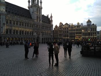 Group of people in front of buildings