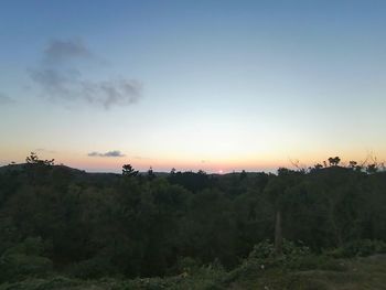 Scenic view of field against sky during sunset