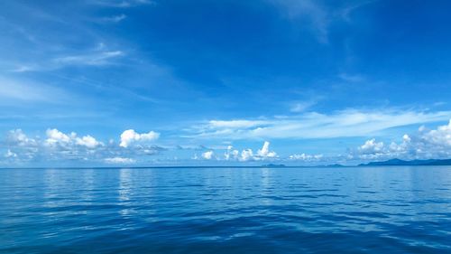 Scenic view of sea against blue sky