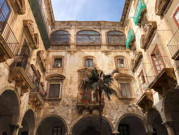 View from courtyard of crumbling ballaro hotel building