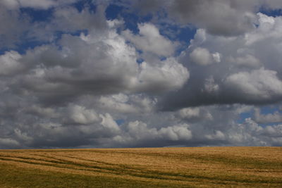 Scenic view of landscape against cloudy sky