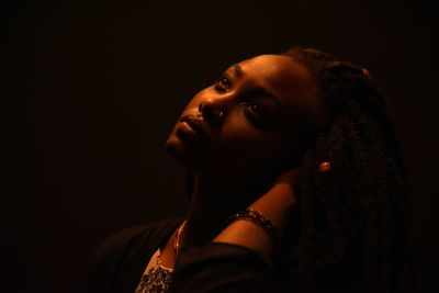 Beautiful young woman in darkroom