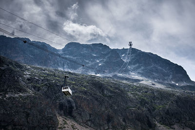 Scenic view of mountains against sky. scenic view of cable car of mountain. gondola on alps 