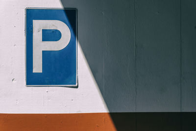 Parking sign on wall